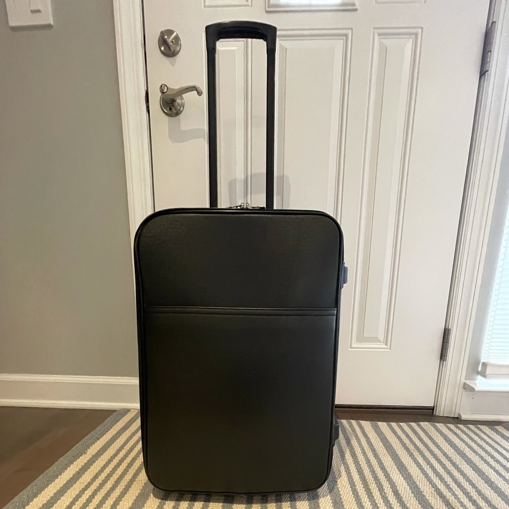 This is a Louis Vuitton travel bag black.
